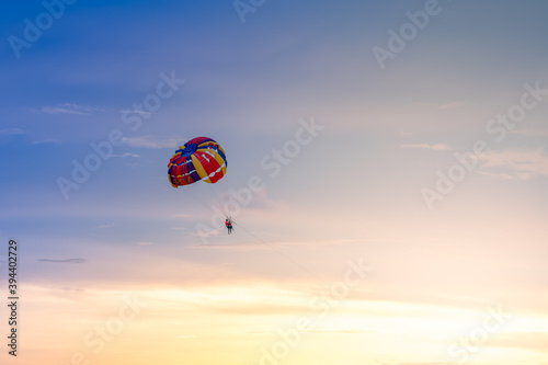 Colorful parachute in the sky on beautiful sunset