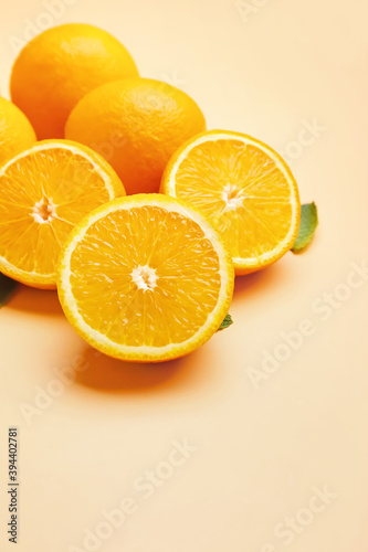 Juicy orange fruit on color background