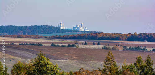 Autumn field on the background of the monastery