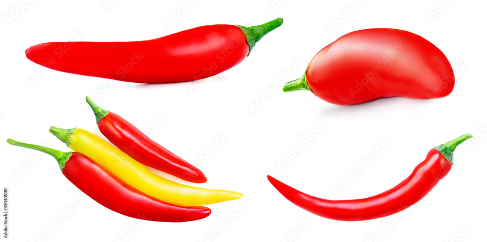 Red and yellow chili peppers isolated on a white background. Fresh colorful peppers close up. Red and yellow chili peppers isolated on a white background. Fresh colorful peppers close up.