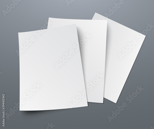 Three blanks of paper with shadows lie on a gray background. A4 paper page, mockup, sheet on the table - vector