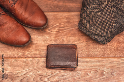 Men's clothing and accessories on a wooden background in warm colors