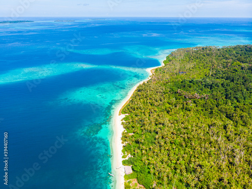 Aerial: exotic tropical island white sand beach away from it all, coral reef caribbean sea turquoise water. Indonesia Sumatra Banyak islands