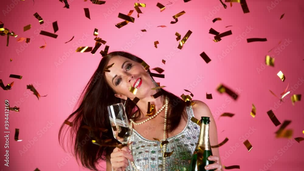 Super Slow Motion of Excited Brunette Woman with falling confetti dancing and jumping, having fun Concept of happiness, party, winning. Super Slow Motion of Excited Brunette Woman with falling confetti dancing and jumping, having fun Concept of happiness, party, winning.