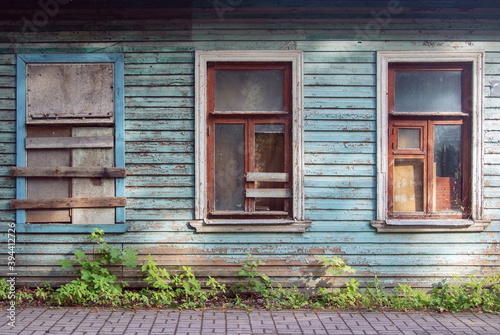 Three interesting Windows in a blue wooden old wall