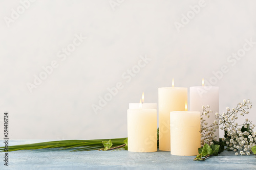 Beautiful aroma candles on table in room