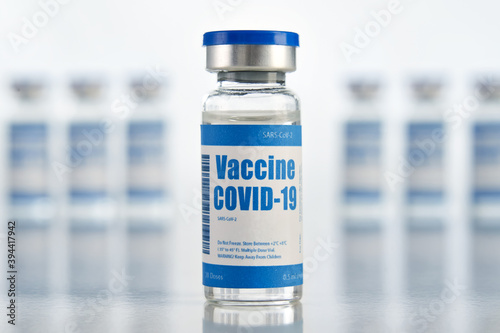 Corona virus covid 19 vaccine vial bottle for intramuscular injections isolated on medical pharmacy industry background. Coronavirus cure manufacture, flu treatment drug pharmacy production concept.