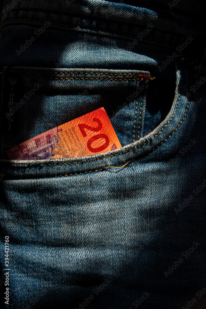 Twenty Swiss francs paper note in jeans pocket. - obrazy, fototapety, plakaty 