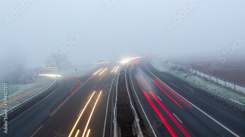traffic on the highway in deep fog, long exposure