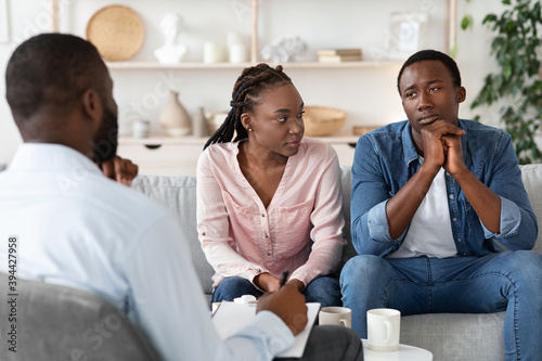 Family Counseling. Young Black Spouses Having Meeting At Marriage Therapist Office © Prostock-studio