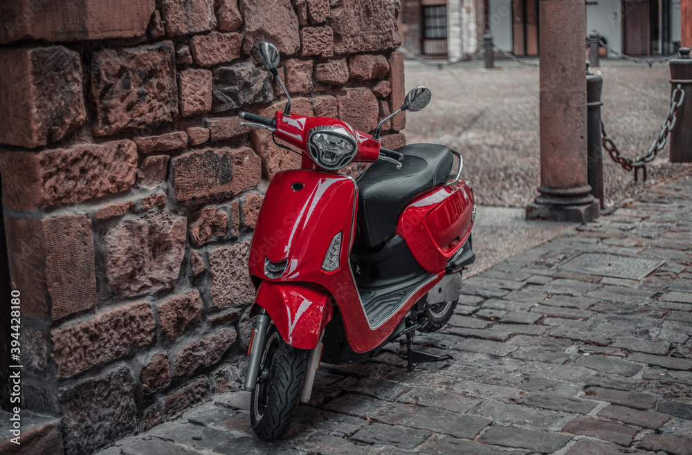 Red motorcycle in traditional European town