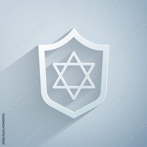 Paper cut Shield with Star of David icon isolated on grey background. Jewish religion symbol. Symbol of Israel. Paper art style. Vector.