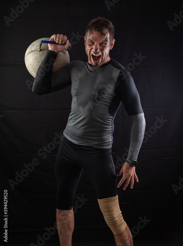Handsome Athletic Men Exercising With big Kettlebell