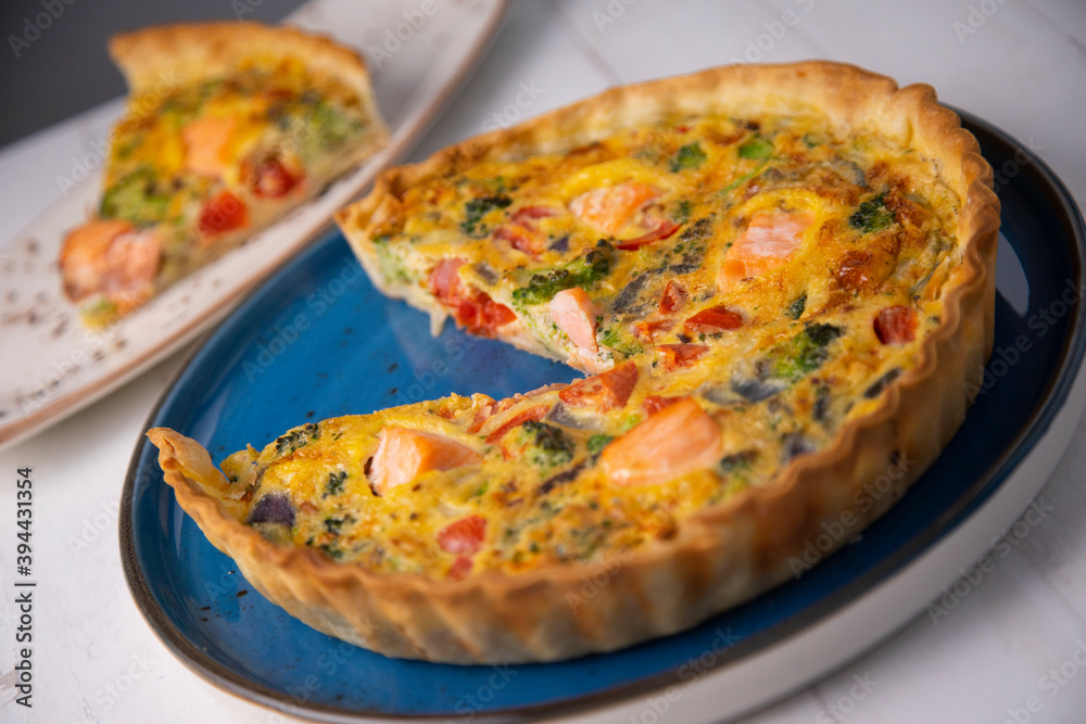 Traditional salmon quiche with broccoli and vegetables Traditional salmon quiche with broccoli and vegetables