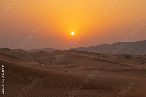 sunset in the desert in dubai