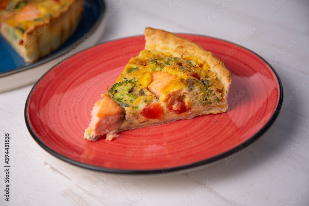Traditional salmon quiche with broccoli and vegetables Traditional salmon quiche with broccoli and vegetables