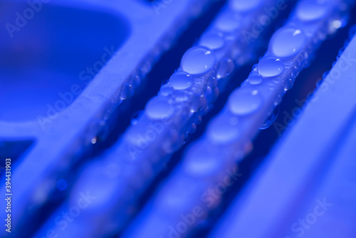 water drops on blue background. blue water drops on an abstract background.