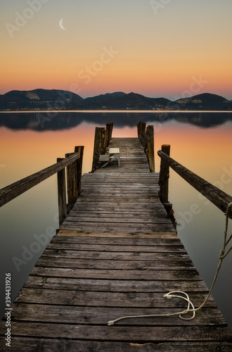 pier at sunset on a tuscany lake
