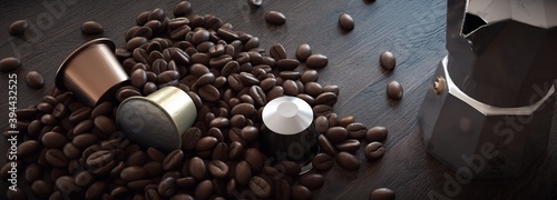 Composition with coffee beans and assorted capsules on rustic wood with Italian coffee maker in the background. photo