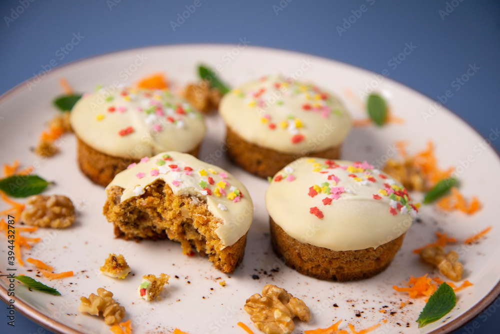 Mini carrot cake with white chocolate cover and sprinkles