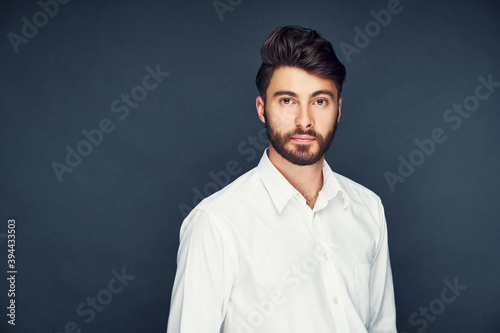 Portrait of handsome man isolated on dark blue background