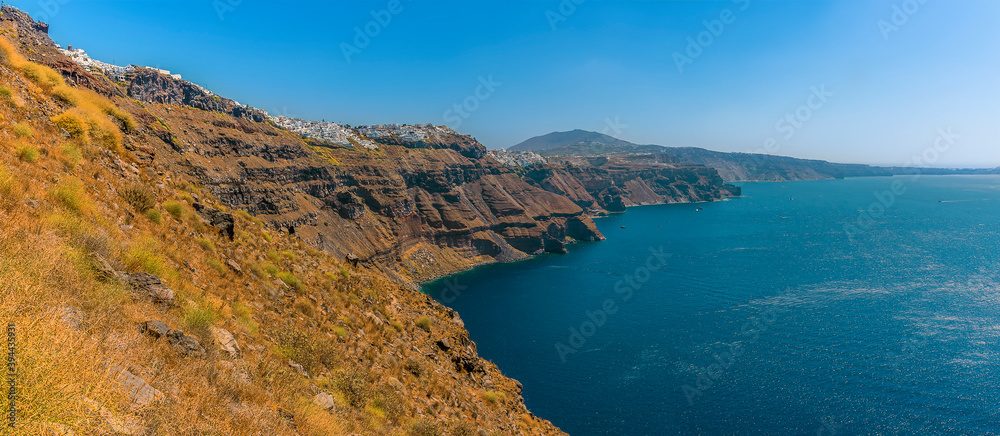 A view from Skaros Rock, Santorini towards Fira and the southern rim of the caldera in summertime