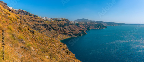 A view from Skaros Rock, Santorini towards Fira and the southern rim of the caldera in summertime