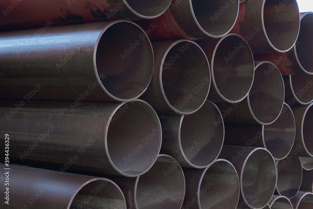Bunch of metal pipes. Steel water pipes. Large steel pipes close up. Bunch of metal pipes. Steel water pipes. Large steel pipes close up.
