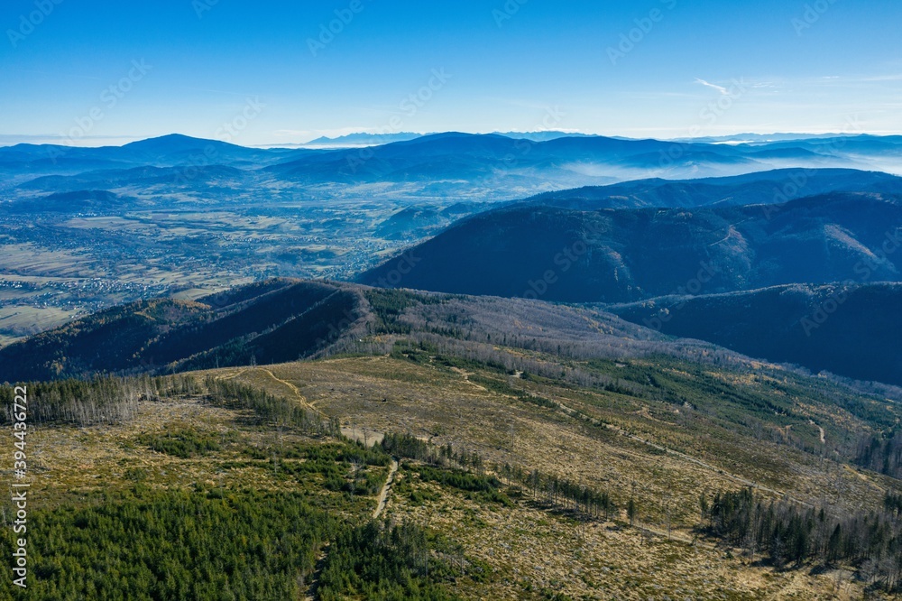 Naklejka premium Polish mountains in Silesia Beskid in Szczyrk. Skrzyczne hill inPoland in autumn, fall season aerial drone photo