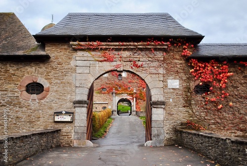 Attendorn, Germany;  Autumn colors on the entry gate at Burg Schnellenberg castle in Attendorn, Germany. In the Olpe district in North Rhine-Westphalia. photo