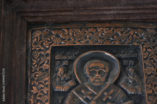 close-up religious image of metal in a frame 