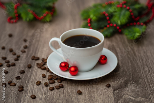 Coffee Cup with Christmas decorations on wooden table
