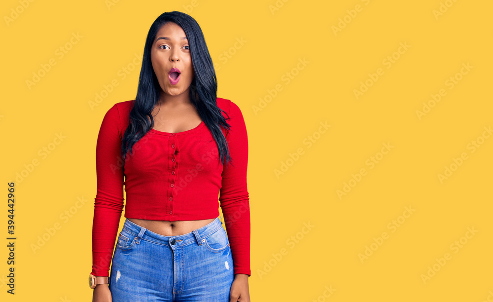 Hispanic woman with long hair wearing casual clothes scared and amazed with open mouth for surprise, disbelief face Hispanic woman with long hair wearing casual clothes scared and amazed with open mouth for surprise, disbelief face