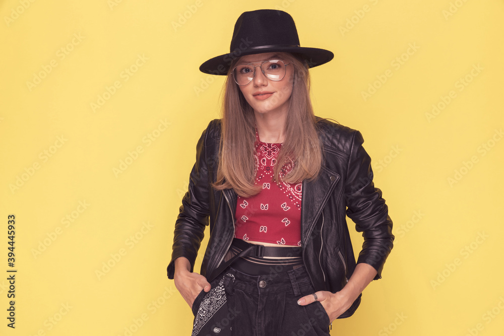 beautiful casual woman posing with her hands in her pockets