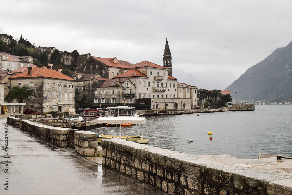Charming town of Perast in a cloudy day. Ancient buildings by Kotor Bay. Perast, Montenegro.