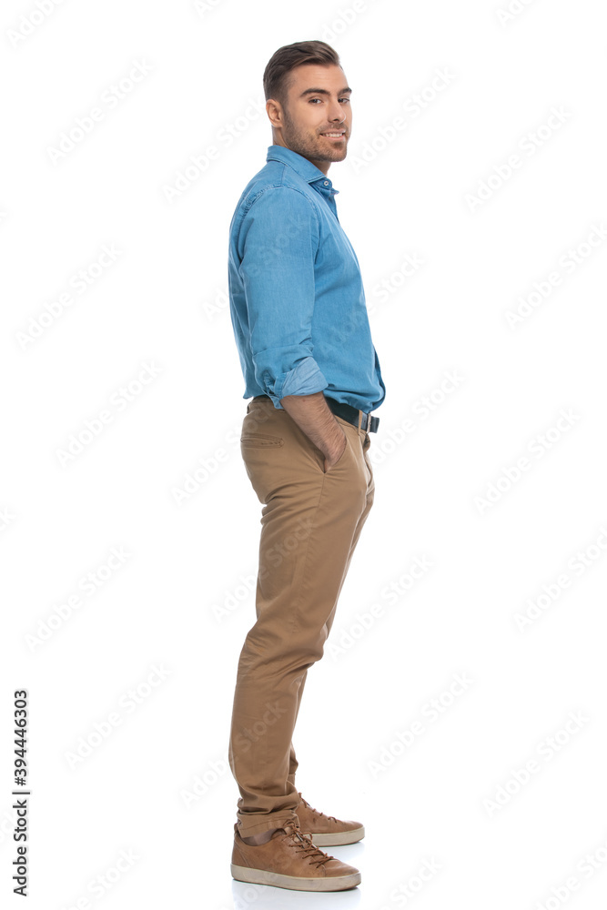 young casual man standing to a side young casual man standing to a side