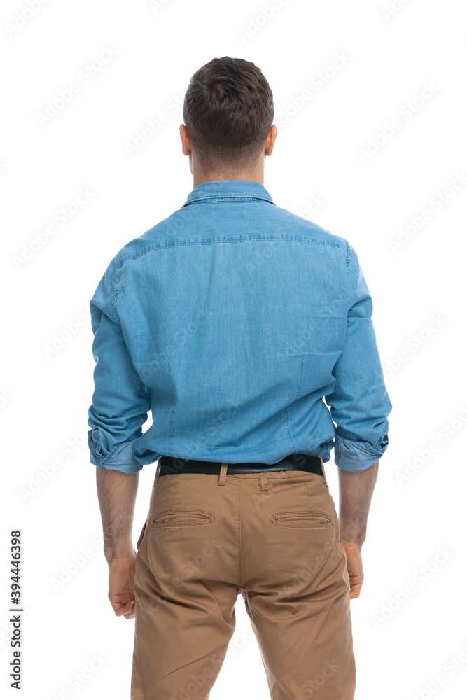 casual man looking ahead and wearing a blue shirt casual man looking ahead and wearing a blue shirt
