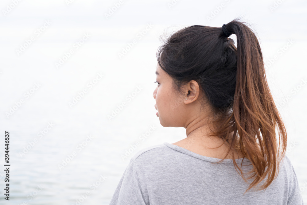 Young woman looking at sea, Sweden