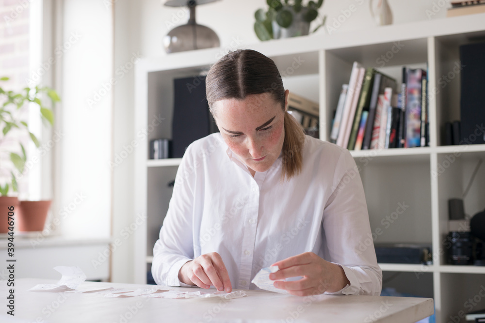 Woman doing paper work, Sweden Woman doing paper work, Sweden