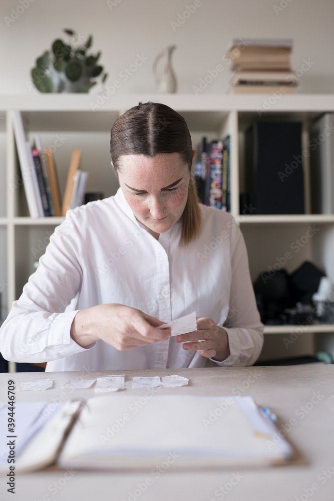 Woman doing paper work, Sweden Woman doing paper work, Sweden