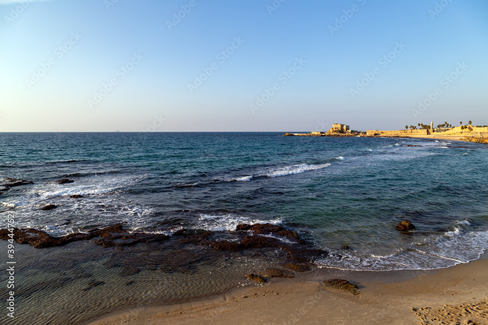 View on the Mediterranean Sea, with the old port of Caesarea in the background, Israel