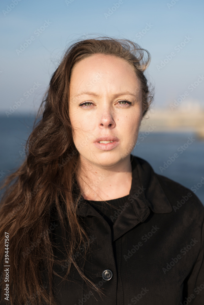 Young woman at sea, Sweden Young woman at sea, Sweden
