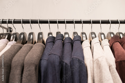 Shirts and sweaters on clothing rack, Sweden photo