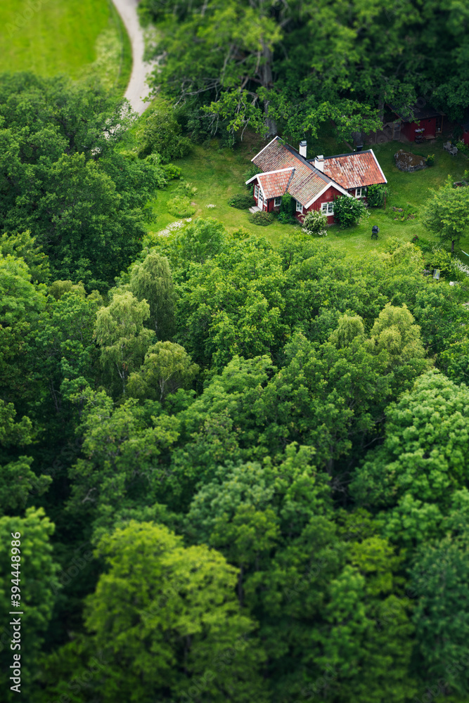Aerial view of house among trees, Sweden Aerial view of house among trees, Sweden