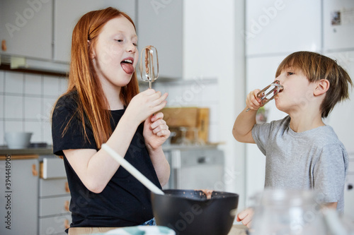 Children licking whisks, Sweden photo