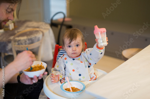 Father feeding son, Sweden photo