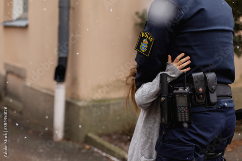 Police woman hugging daughter, Sweden photo