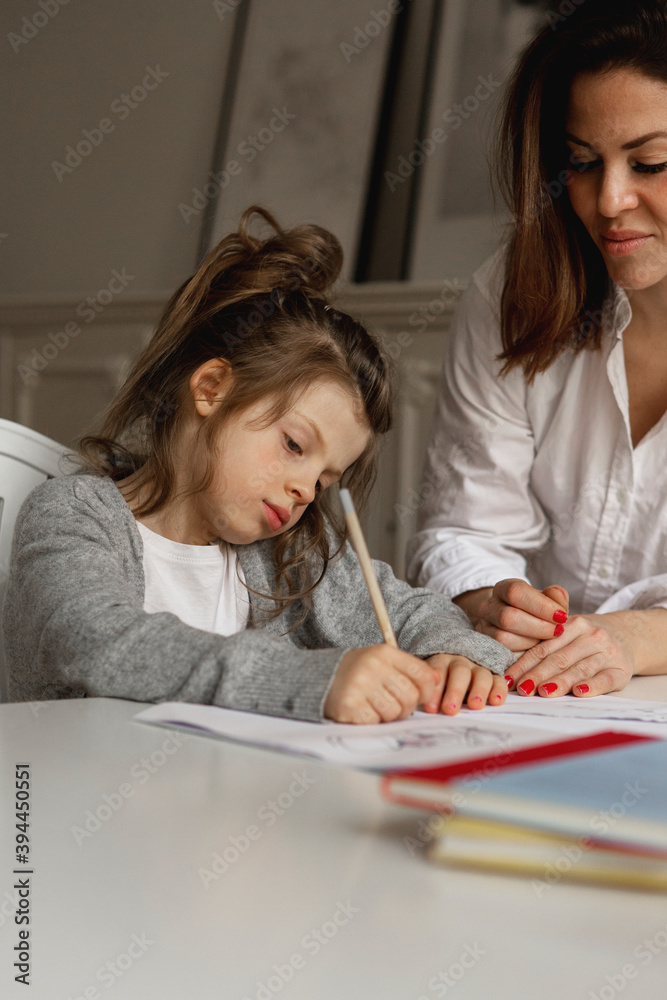 Mother helping daughter with homework, Sweden Mother helping daughter with homework, Sweden