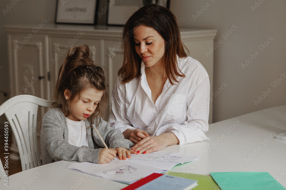 Mother helping daughter with homework, Sweden Mother helping daughter with homework, Sweden