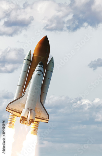 Rocket spaceship. Blue skies. The elements of this image furnished by NASA.